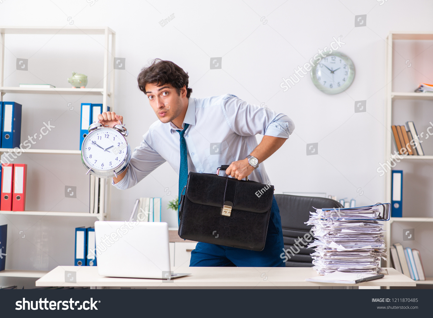 Overloaded Busy Employee With Too Much Work And Paperwork Stock Photo