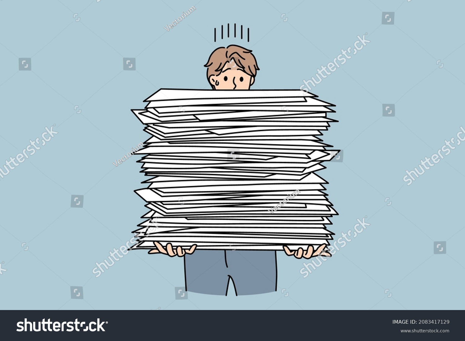 Stressed Male Employee With Stack Of Paperwork Overwhelmed With